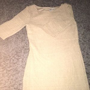 A tan dress with short-sleeves.